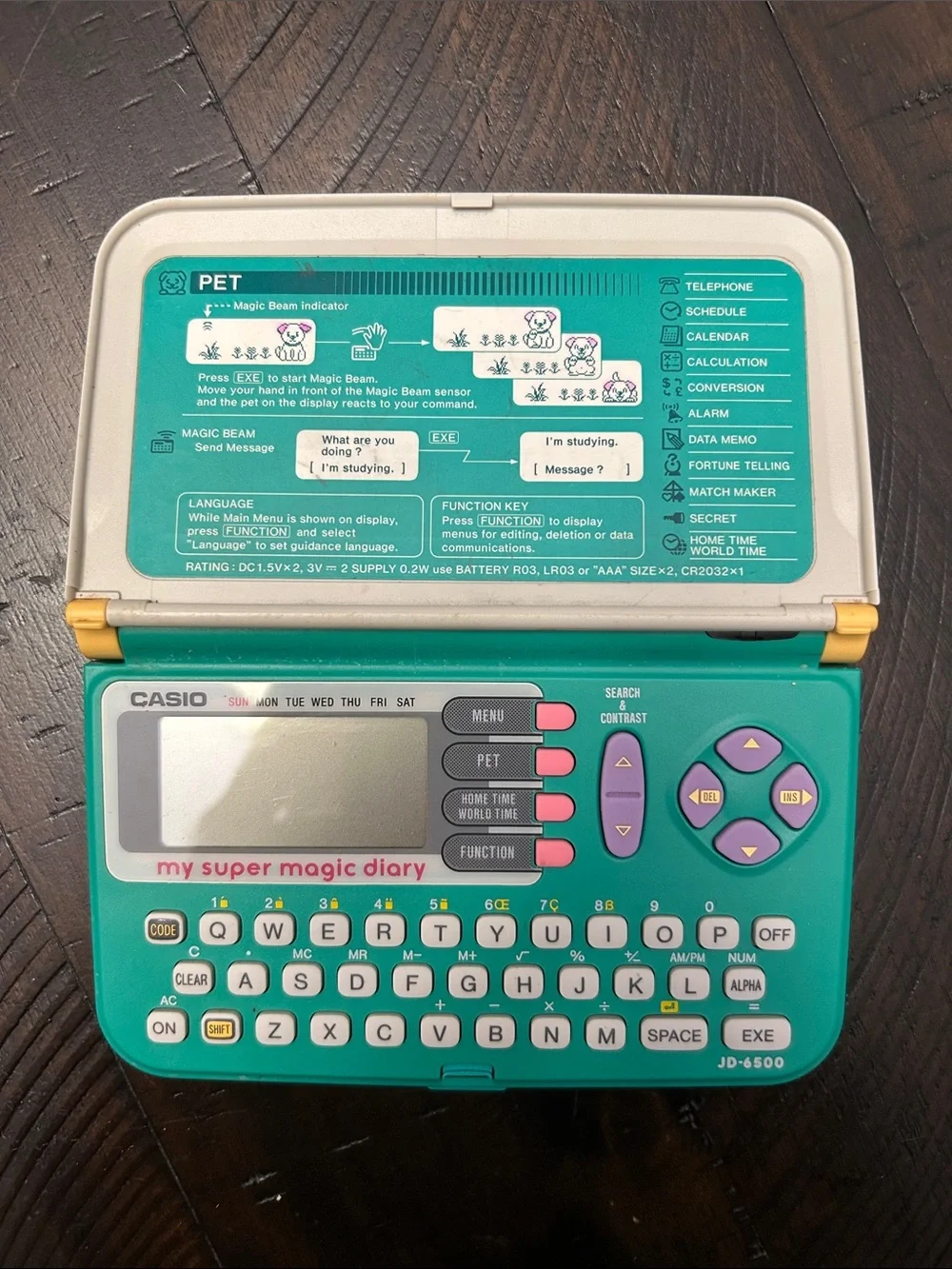Vintage Casio Pet Action Handheld Diary in Teal, Yellow & Cream.  Not tested